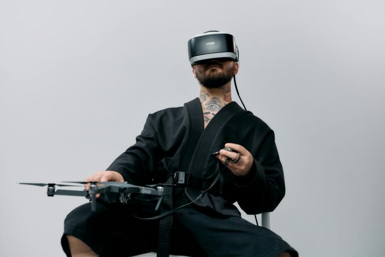 A man in black attire using a VR headset to control a drone in a studio setting.